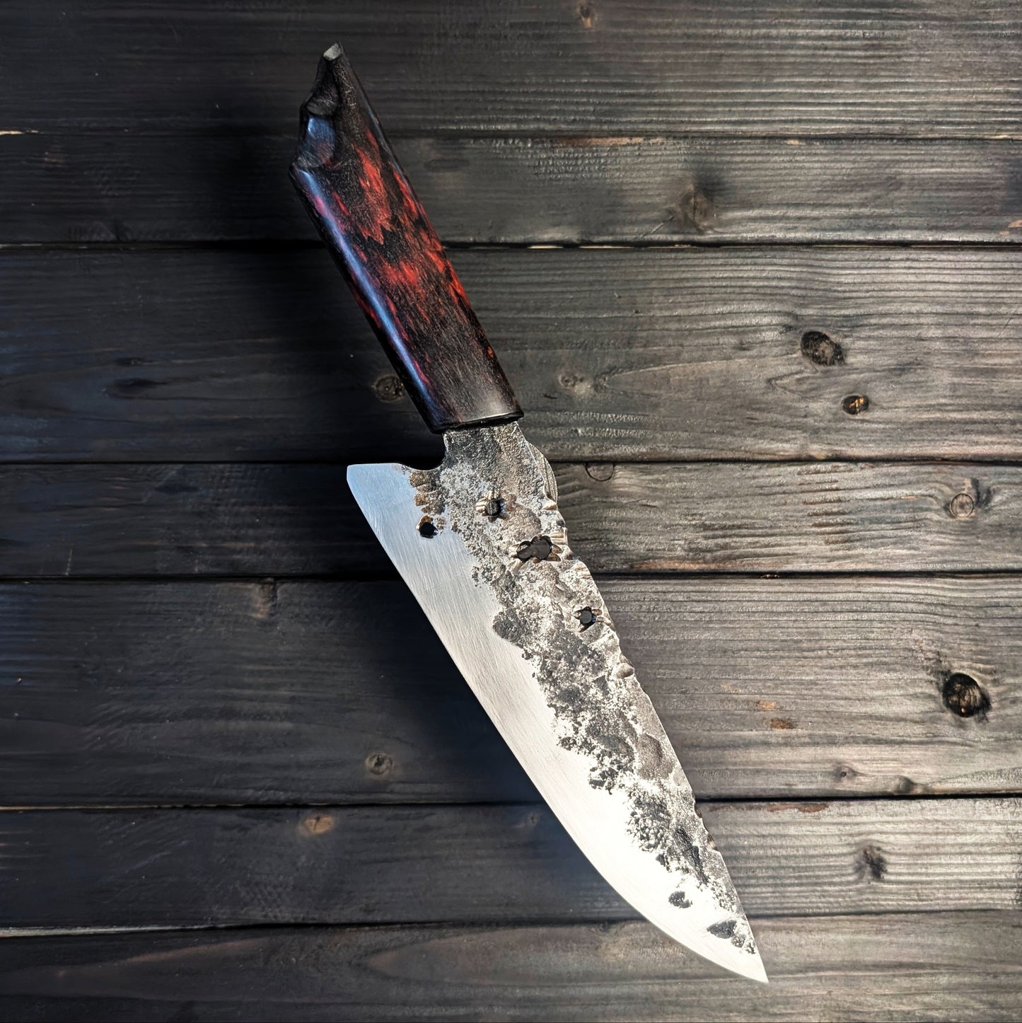 Chef knife - high carbon blade with holes in the spine and red handle